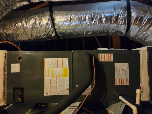 After: new Goodman residential air handler with clean line set and insulated supply